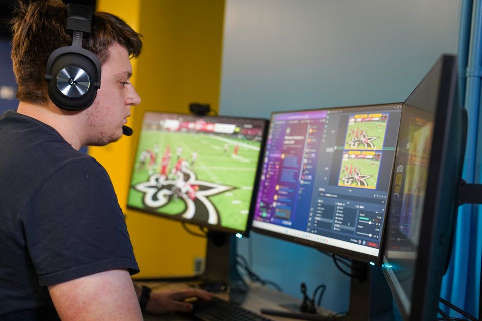 WVU Esports student worker Cooper Martin works behind the scenes during a broadcast.
